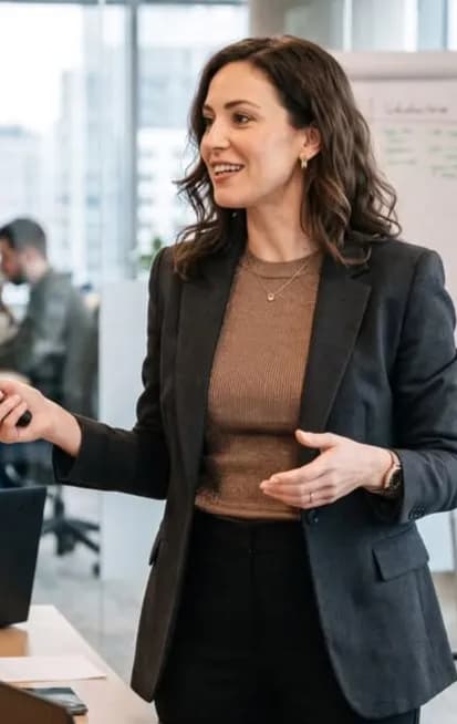 A professional presenting to colleagues in a modern office